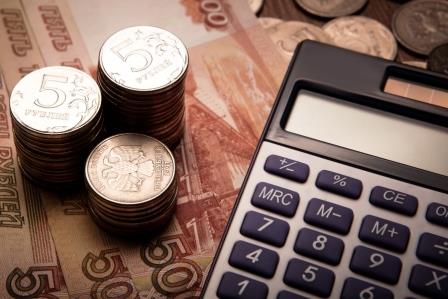 handful of Russian rubles with calculator close up